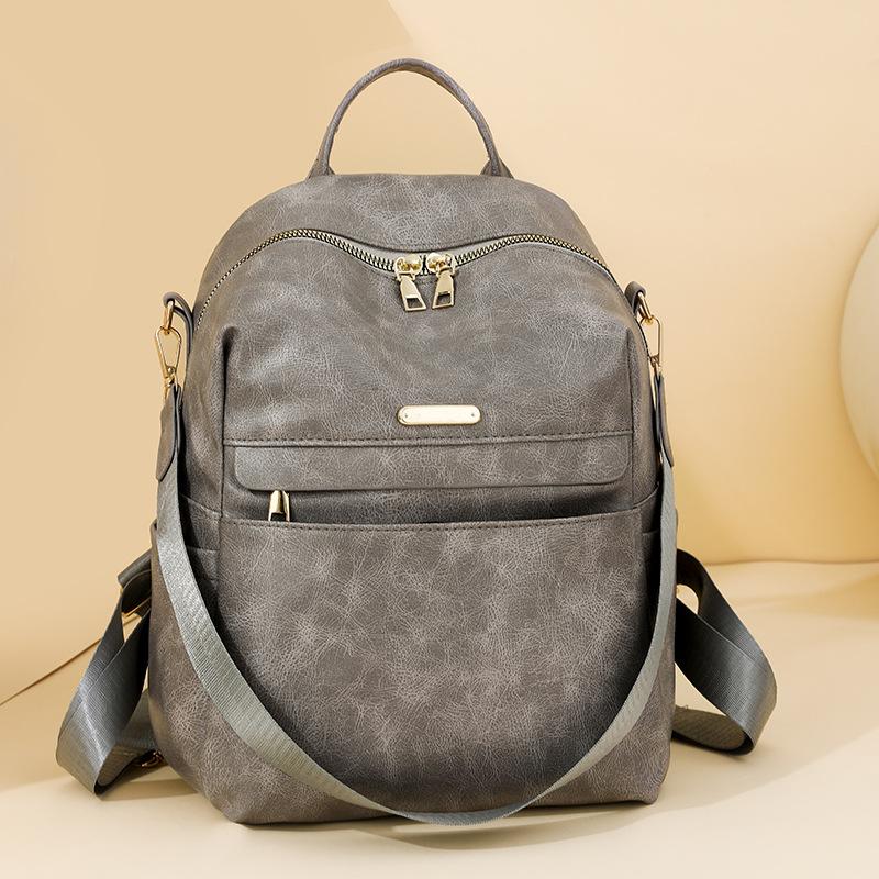 Retro soft leather backpack women's new fashion trend backpack student simple shoulder travel bag