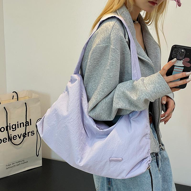 Korean style spring and summer new women's solid color high-end niche shoulder crossbody armpit bag