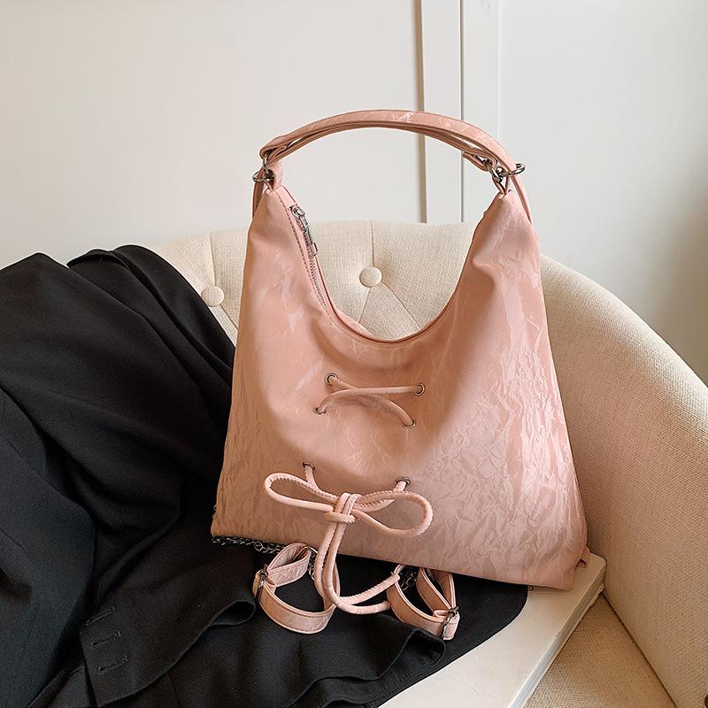 

Large capacity women s simple shoulder armpit bag commuter double shoulder tote bag рожевий
