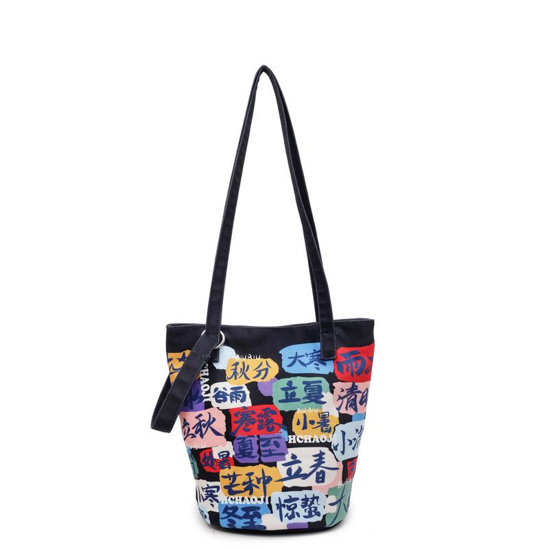 2025 summer contrasting colors Korean version fashionable new handbag bucket bag graffiti handheld lady bag make-up bag to work