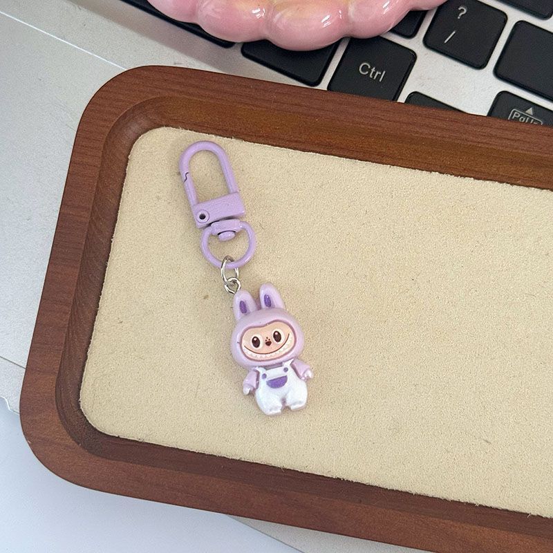 Niedliche Latzhose zum Hochziehen Anhänger Niedlich Cartoon Studenten Tasche Anhänger Geschenk