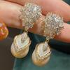 Fashion flower zircon dangle earrings with faux pearl pendant. Luxury bridal style for wedding and banquet occasions.