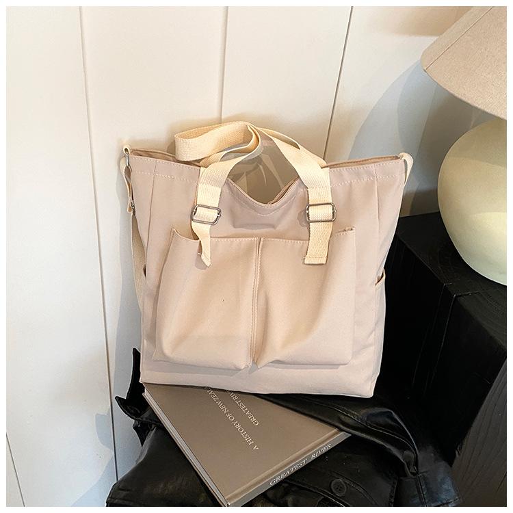 

Women s bag new fashionable commuter shoulder bag, large-capacity student book bag, Japanese and Korean double pocket canvas messenger bag белый