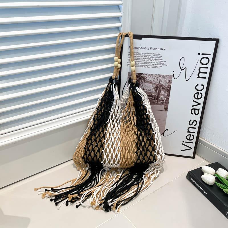 Lazy woven tassel portable shoulder hollow bag beach vacation niche leisure tote bag tide