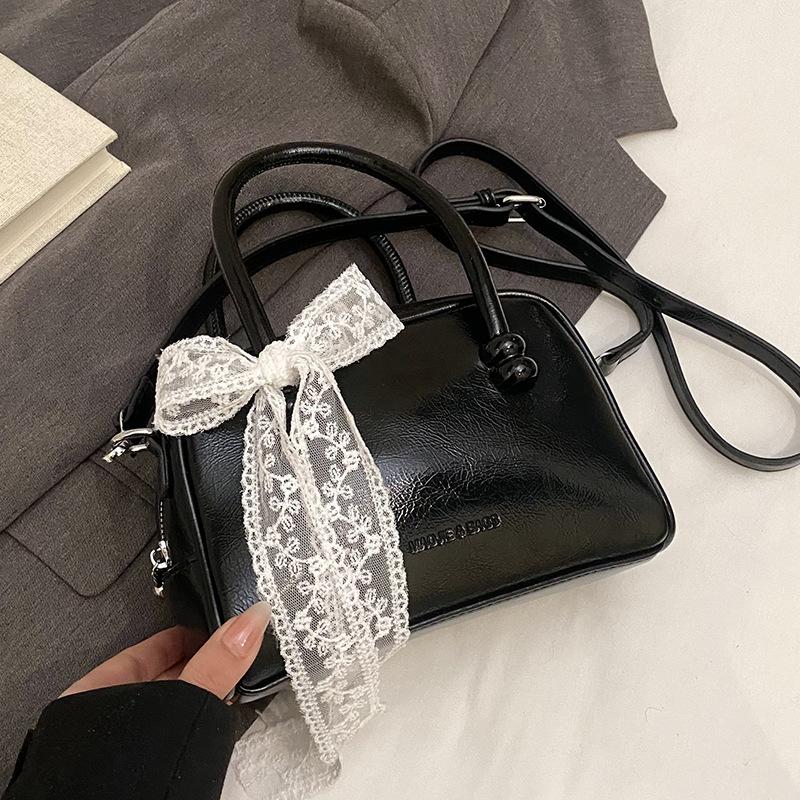 Korean version of the hot sale niche simple solid color hand pillow bag versatile fashion high texture commuter messenger bag women