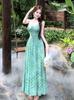 The green polka dot v-neck suspender holiday dress worn by the sea is very beautiful, and the small waist skirt is 2026 summer.