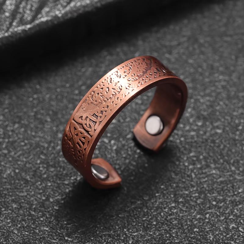A vintage bohemian-style magnetic open ring adorned with a World Tree motif.