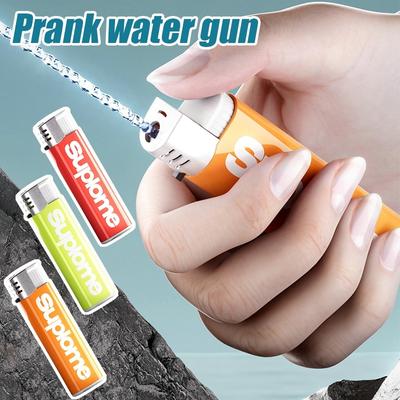 Divertente accendino pistola ad acqua gadget dolcetto o scherzetto scherzo giocattolo per bambini antistress giocattolo per bomboniere regali estate pistola ad acqua giocattolo