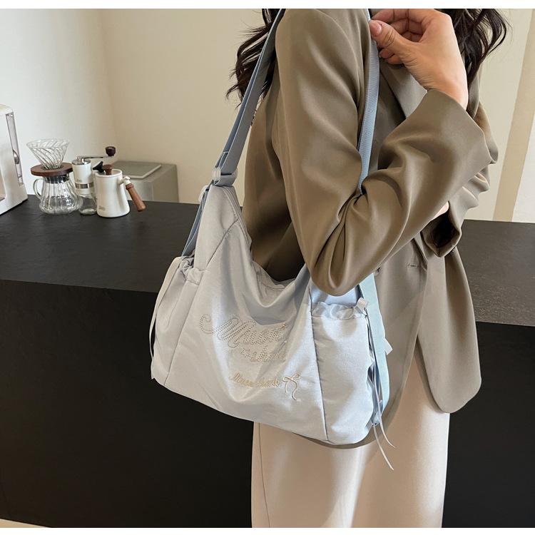 Tote bag women's 2024 new large-capacity commuting letter foreign feeling college students commute to class shoulder backpack