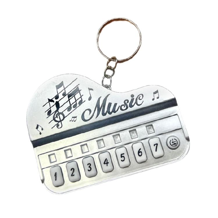 Pocket Sized Electronic Piano Keychain Toy With Multicolor Illuminated Keys Portable Music Learning Device For Children