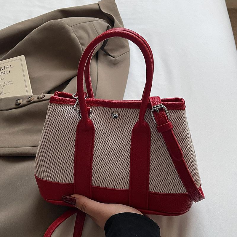 Wholesale Korean version of casual niche contrasting color portable bucket bag commuting versatile simple personality messenger women's bag