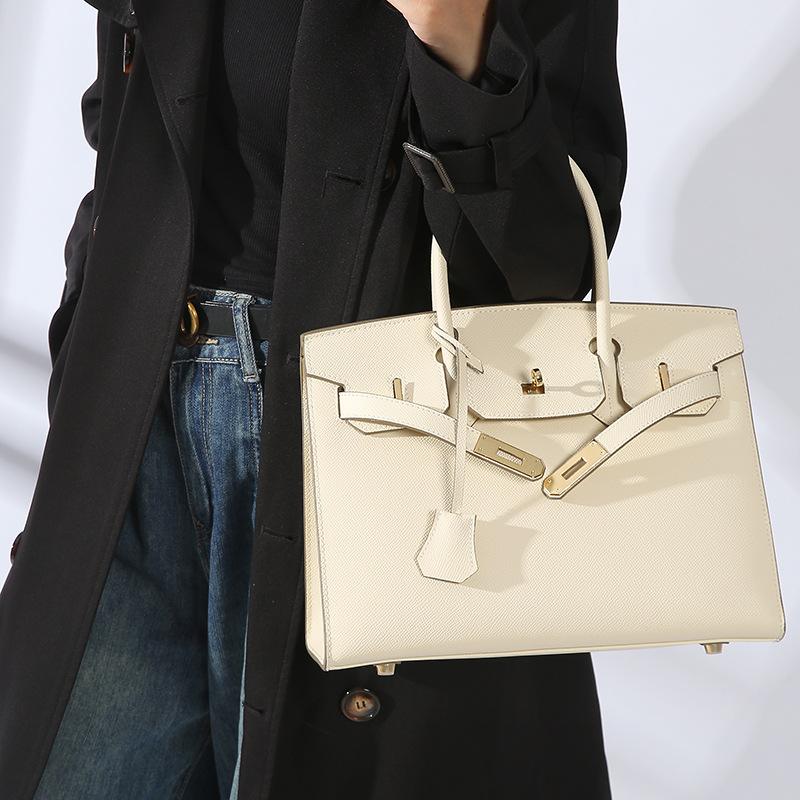 Grenzüberschreitende Explosive EP Handheld Rindsleder Außenriemen Hardware Tasche Hochwertiges Zeitgefühl Echtes Leder Damentasche Mehrstil Handtasche