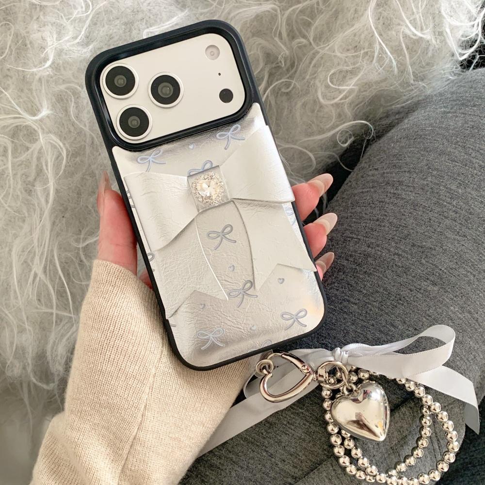 Korean ins silver leather three-dimensional bow, suitable for Apple 17 mobile phone case, new iPhone17promax high value 15 trend 14 flash diamond 13