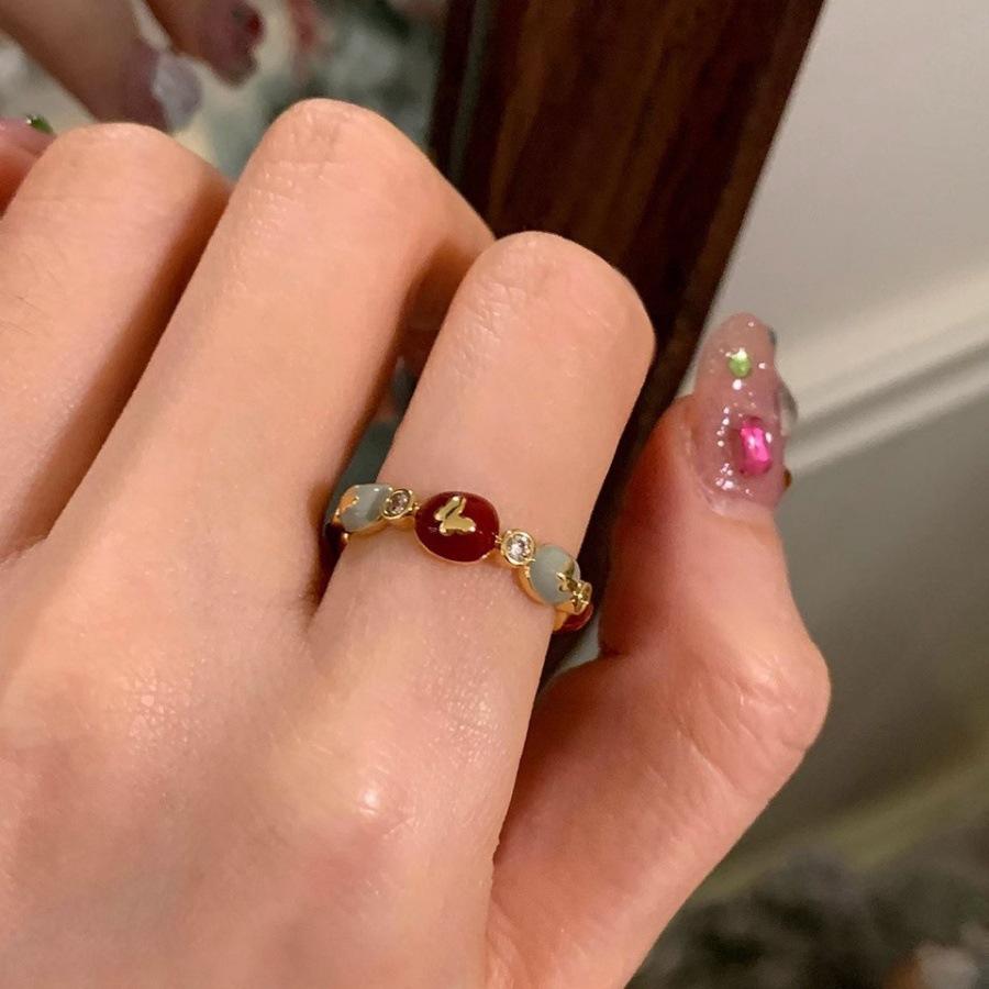 

Red drop glaze zircon bow ring, light luxury index finger ring, versatile gentle adjustable ring.