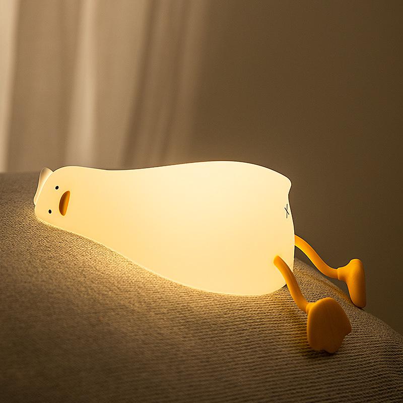 Creative Silicone Duck Night Lamp: Touch-Control LED Bedside Light & Phone Holder.