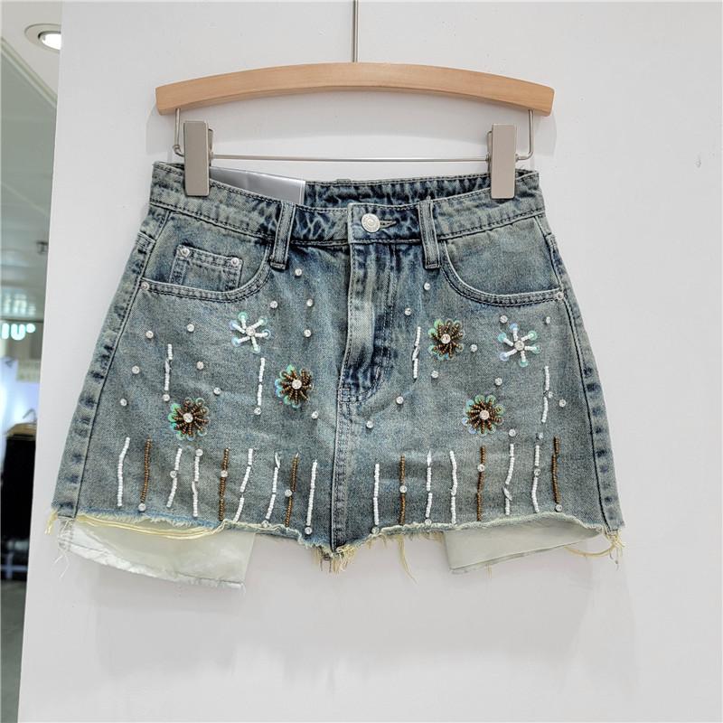 European heavy industry diamond-encrusted denim skirt women s summer retro pocket leakage A-word rough edge hip skirt S