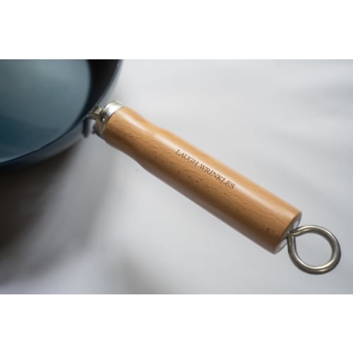 The Little China 24 Iron Frying Pan, a small iron wok that develops with use. Made in Japan, induction compatible, lightweight, no seasoning required,