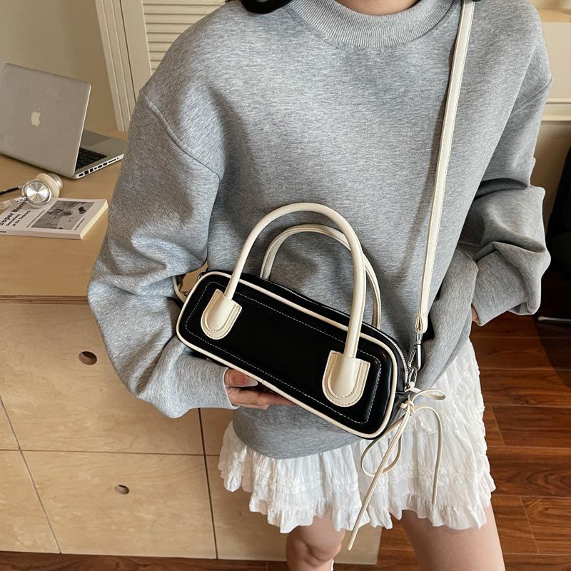 Korean version of fashionable textured portable bowling bag women's 2025 new trend versatile contrasting color baguette underarm women's bag