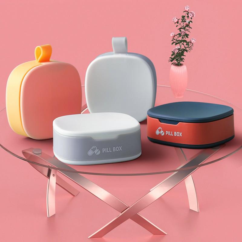 Compact Travel Medicine Box: Portable, Divided, Sealed Pill Organizer with Plastic and Silicone Compartments.