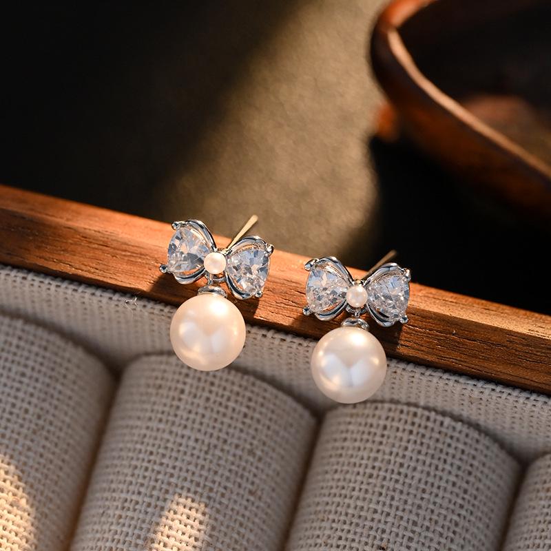 

Изысканные серьги-кисточки с жемчугом и бантом - Элегантная роскошь, мода 2024 для женщин