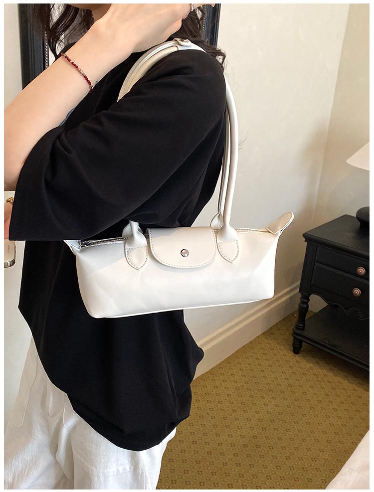 2026 French Light Luxury Cowhide Long Handle Dumpling Baguette Crossbody Bag