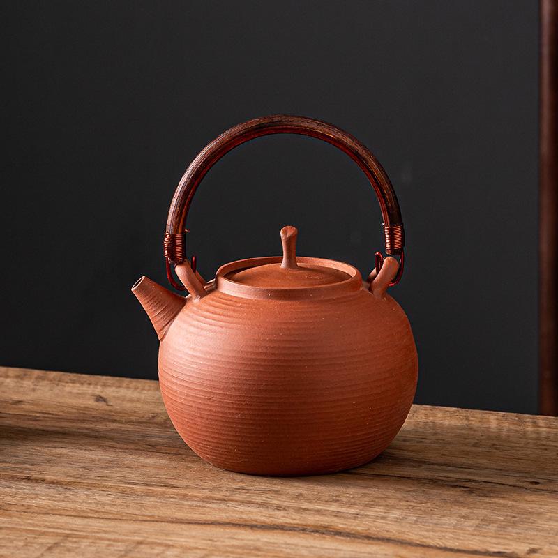 Ceramic Kung Fu Tea Set: Black Teapot with Side Handle and Charcoal Stove for Open Fire.