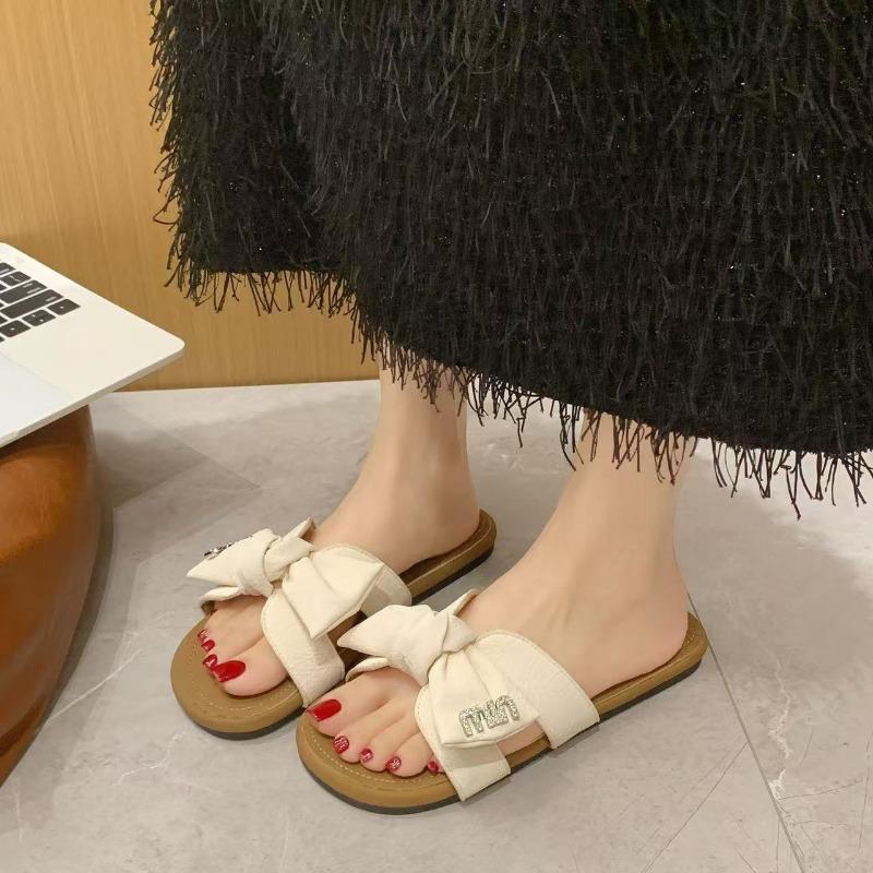 Summer new women's shoes flat-soled wear cool slippers bow fashion one-word drag soft-soled beach shoes