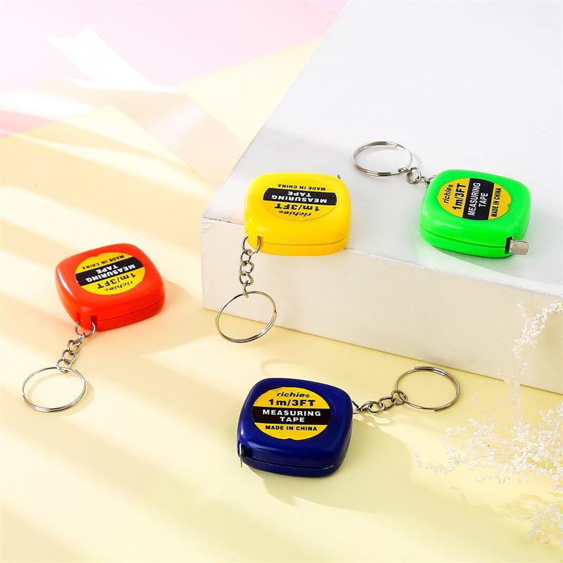 Retractable Mini Iron Ruler Keychain Pendant with Measuring Tape - Multipurpose Steel Ruler for Easy Measurements On the Go.