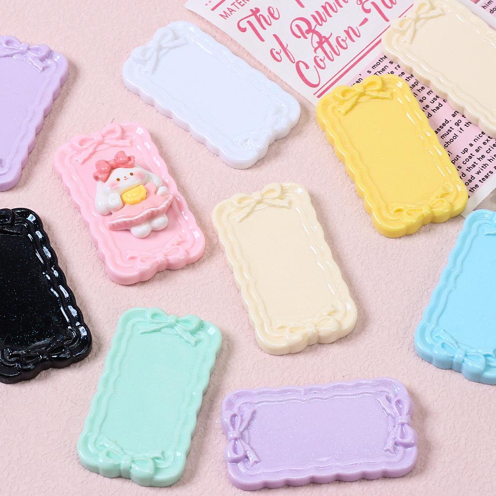 Tegneseriesløyfemønster harpiksplate for DIY hårnål og magnetlaging