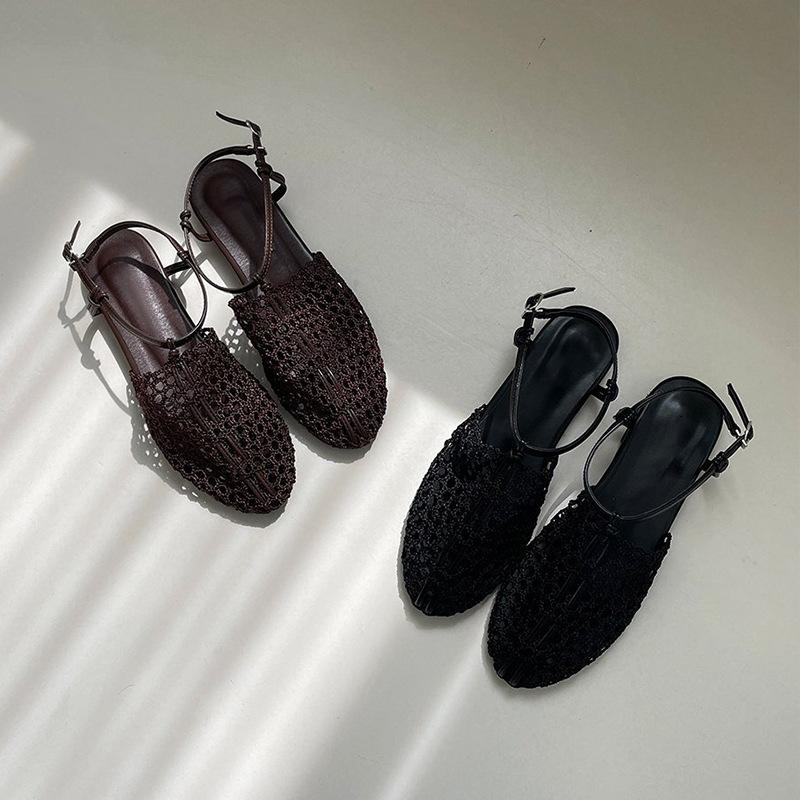 Sheepskin summer new niche woven Roman shoes one-word buckle flat bottom fishing net bag head sandals women wear half slippers