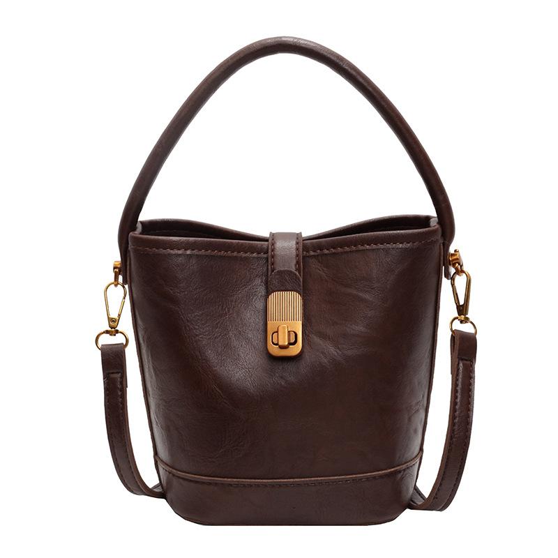 

Нишевый дизайн портативная маленькая сумка женская новая ретро универсальная сумка через плечо иностранный стиль сумка-мессенджер сумка-ведро темно-коричневого