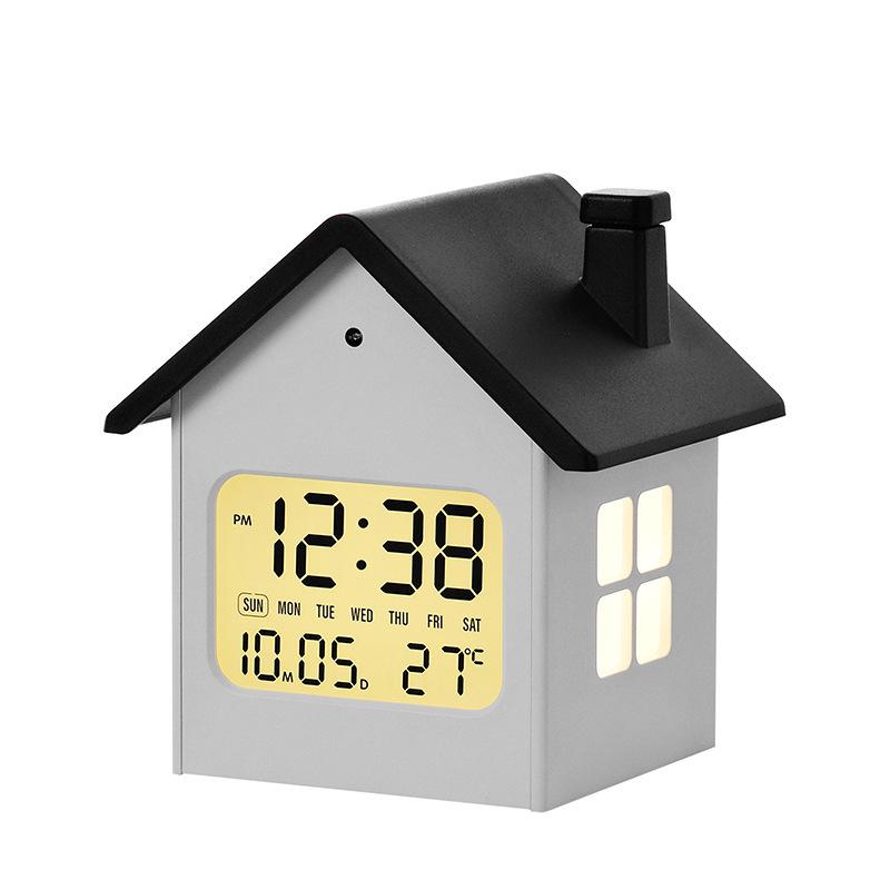 Hausförmiger Multifunktionaler Kinderwecker mit Nachtlicht und LCD-Anzeige.