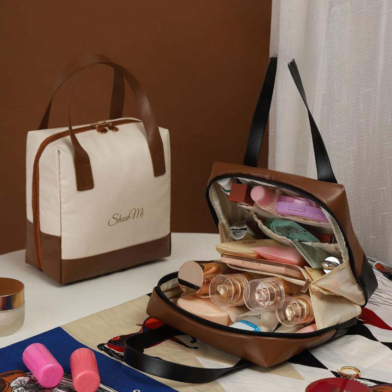 2025 Neue High-End-tragbare Hautpflege-Aufbewahrungstasche Reise-Kulturtasche Make-up-Tasche Damen Große Kapazität Damen-Handtasche SM085