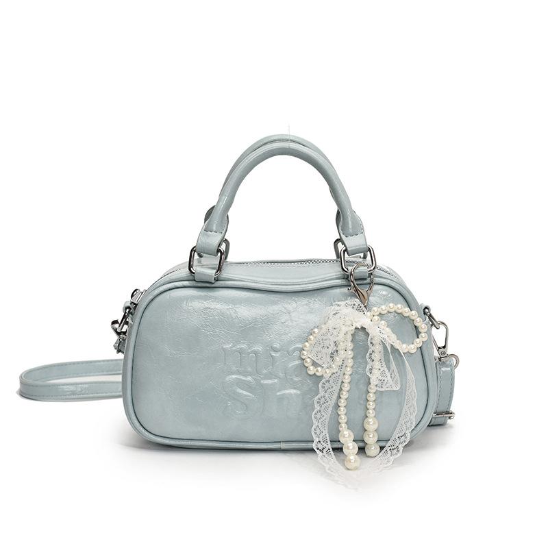 

2025 new Korean version retro simple portable bowling bag niche sweet wind commuter versatile messenger bag woman