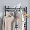Standing clothes rack for shoes in the hallway with shelves, black, wardrobe