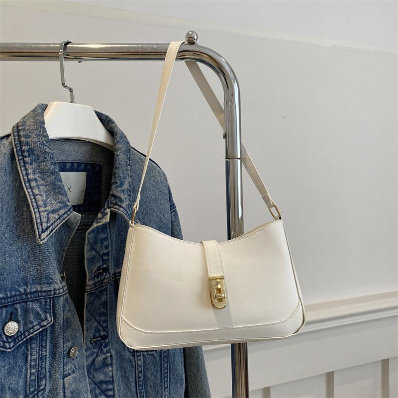 

Корейская нишевая дизайнерская сумка женская 2025 новая высококачественная текстура портативная сумка под мышкой универсальная модная сумка через плечо белый