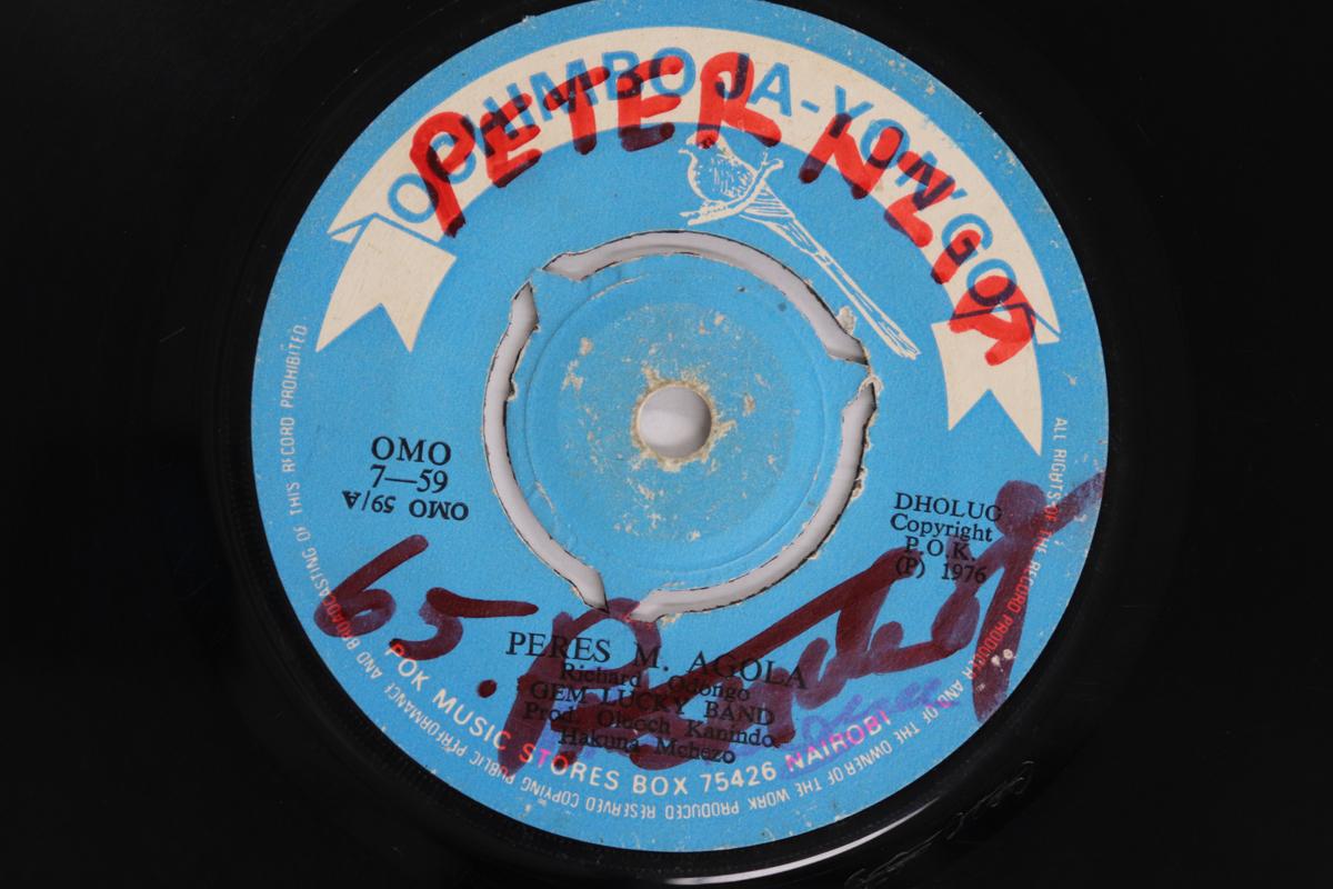

7-дюймовая пластинка GEM LUCKY BAND GEM LUCKY BAND GEM L - Перес М. Agola / Peter Ombe OMO759 OCHIMBO JA-YON 1976 Кения Мировая музыка Б/у