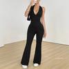 Dámský černý overal s halter krkem a véčkovým výstřihem, zvonové nohavice, bez rukávů, bodycon