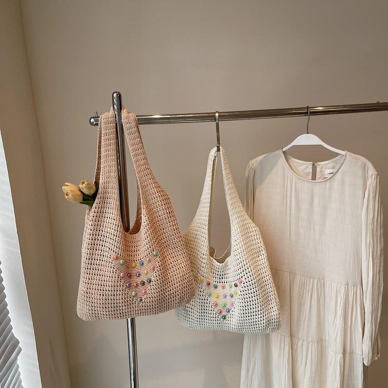 Hollow-out large-capacity knitted bag, new niche design, fashionable single shoulder casual relaxation, literary underarm bag.