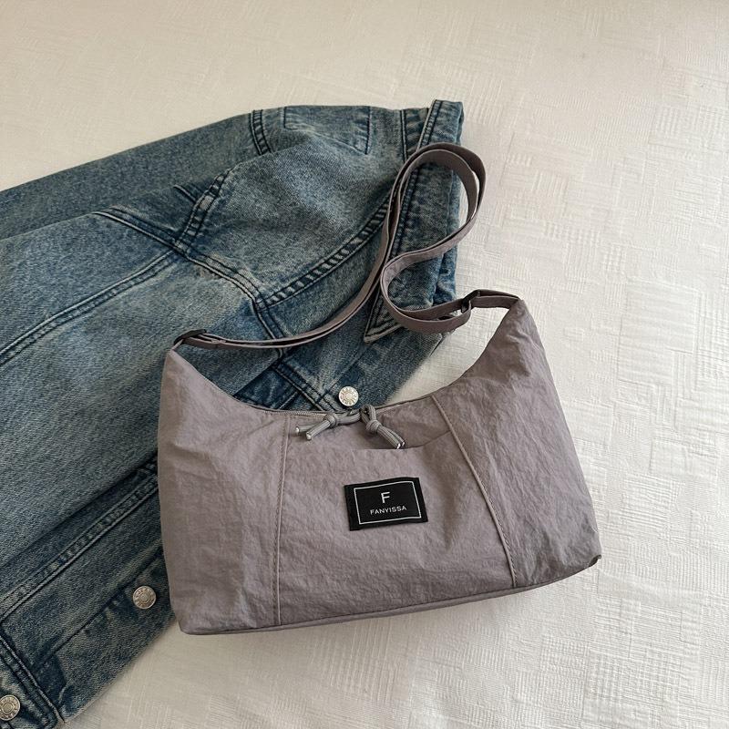 

Wind simple shoulder bag women s new casual versatile commuter canvas bag dumpling bag high value student сірий колір