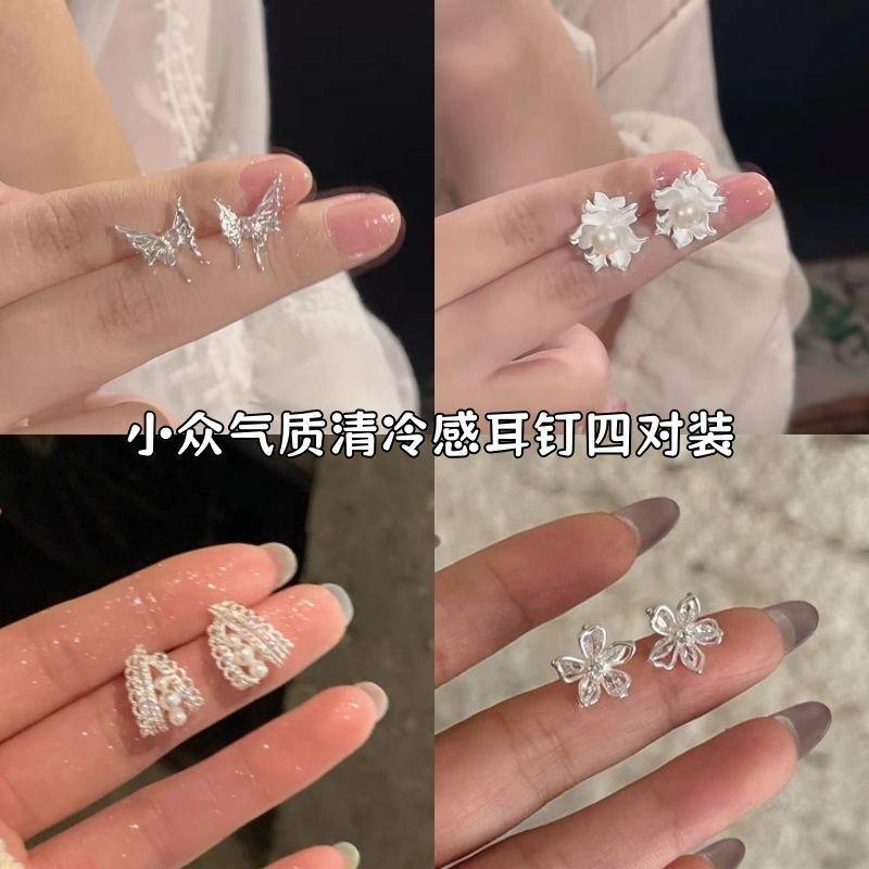 

Hollow flower love pink diamond stud earrings femininity ins versatile earrings niche design light luxury high-end earrings