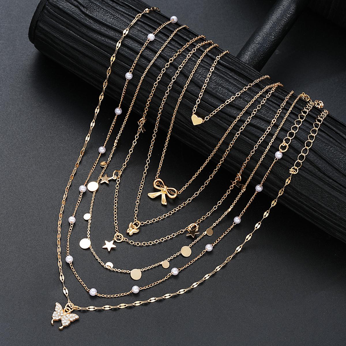 

7Pcs Gold Color Multilayer Pearl Butterfly Necklace For Women Trendy Star Love Heart Bowknot Zircon Pendant Necklace Jewelry Set