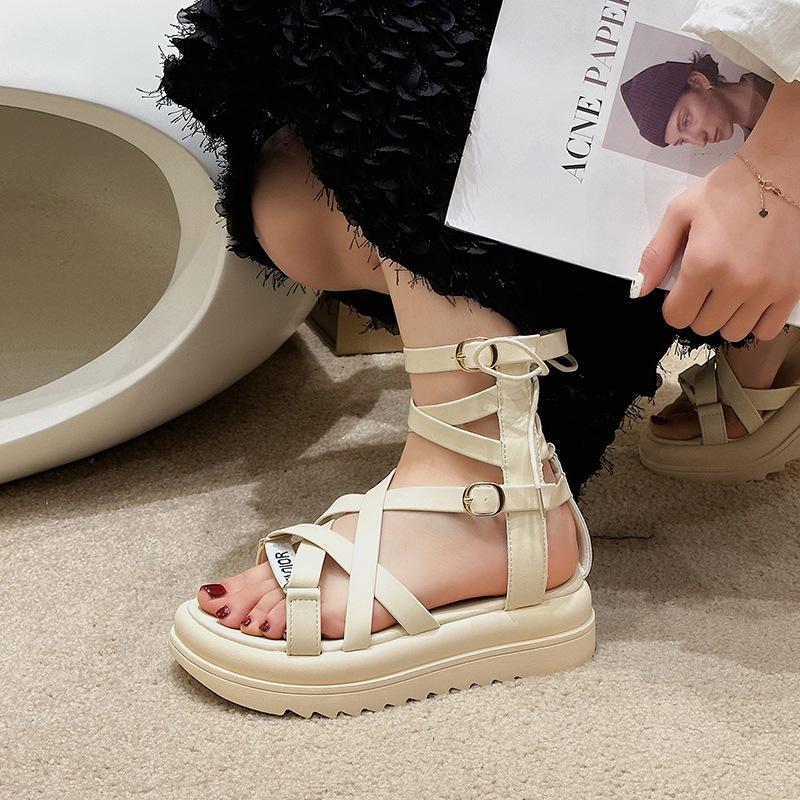 

Fairy wind straps Roman sandals female outer wear 2025 new beautiful flat-bottomed hollow high-top shoes thick-soled cool boots 35