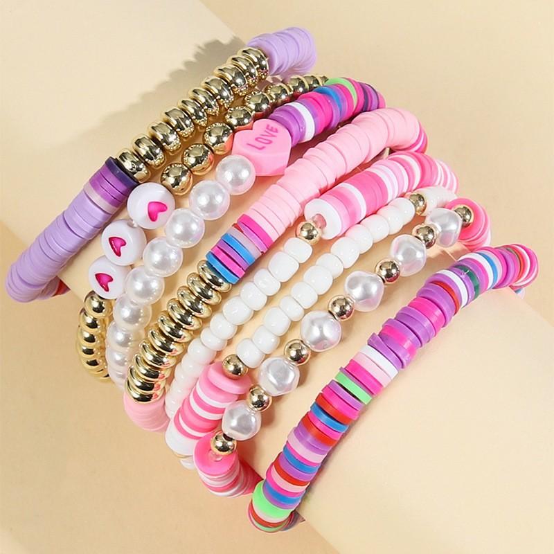 Korean version of fashion new multi-layer elastic thread soft pottery love smiley face bracelet set retro handmade pearl jewelry women