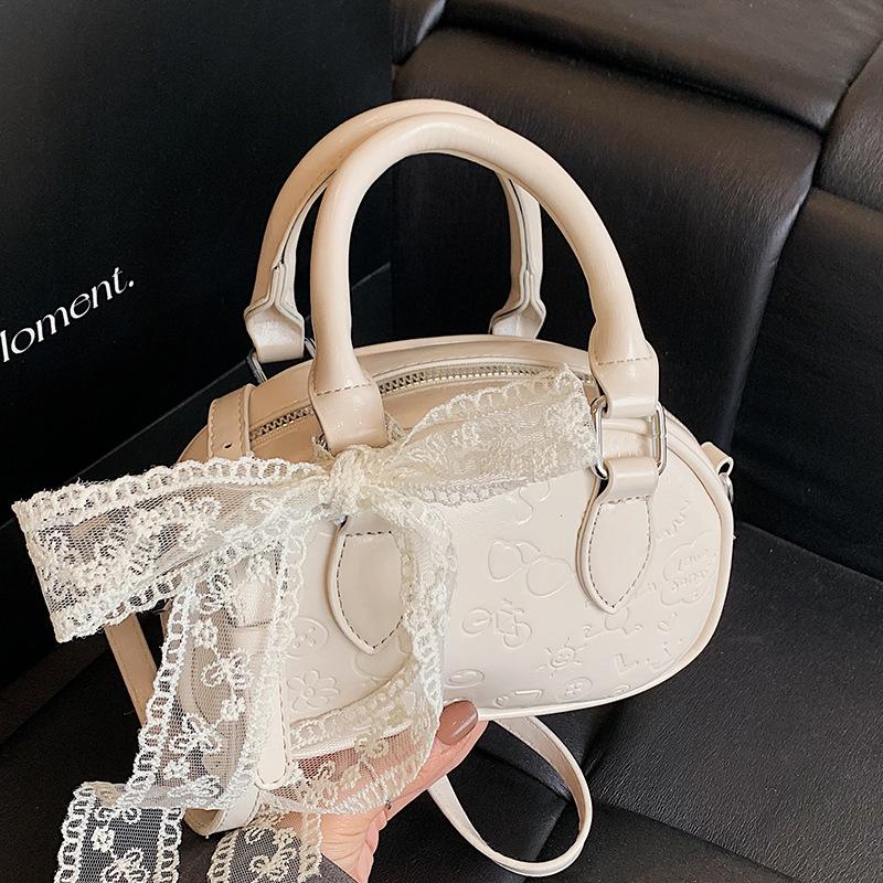 Korean high-end sense sweet wind simple cute embossed portable Boston bag casual versatile foreign style messenger bag women