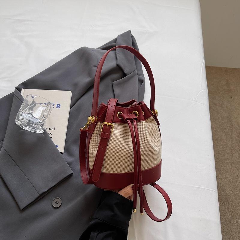 Fashion women's bags new niche high-value contrasting color shoulder messenger bag retro texture portable small bucket bag