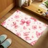 Pink ribbon, floral, and heart patterned floor mat, machine washable polyester, suitable for bedroom and living room decoration.