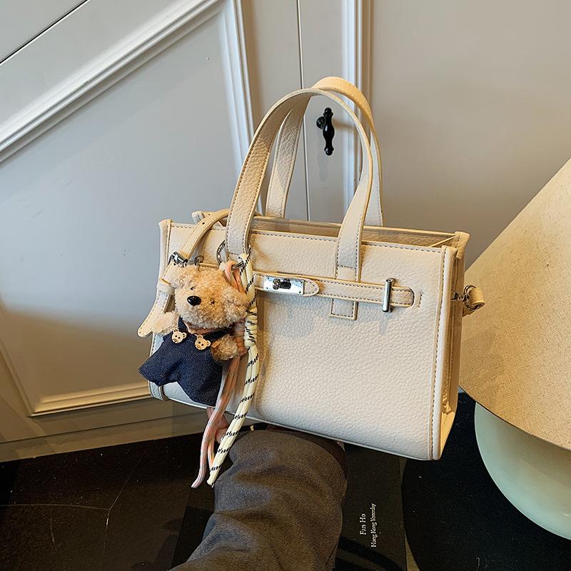 Niche portable small square bag women's new fashion versatile simple shoulder bag casual commuter messenger bag