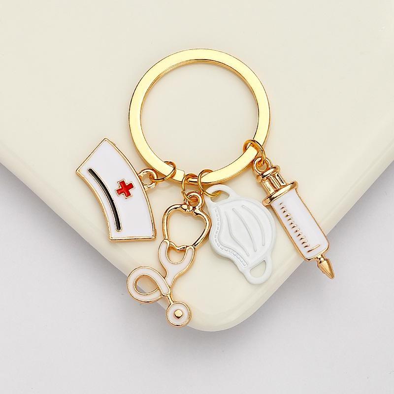 

Брелок для медсестры, металлический брелок для медсестры со шприцем, шапочкой для медсестры и стетоскопом для доктора, студента, медсестры, подарки белый