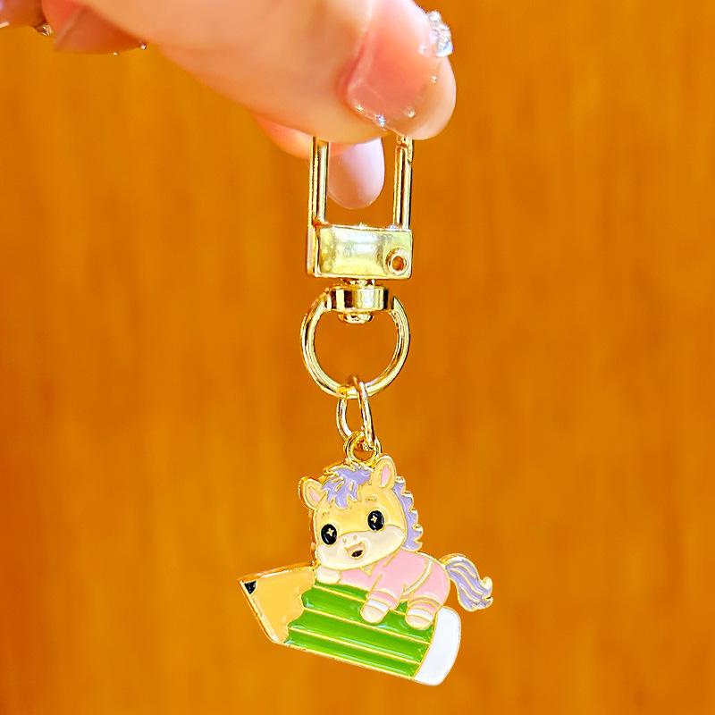 Golden Horse Keychain: Inspirational Success Charm for Students in Entrance Exams